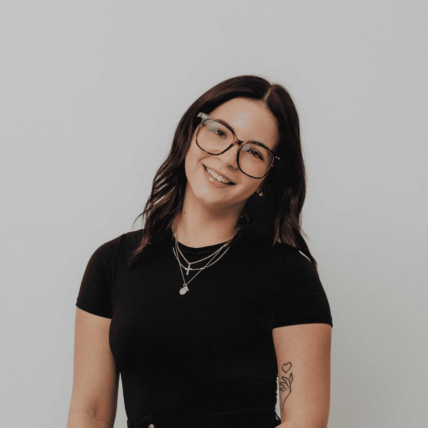 Portrait of Alissa Decker, a professional stylist at The Hair Bar, showcasing their expertise and style.