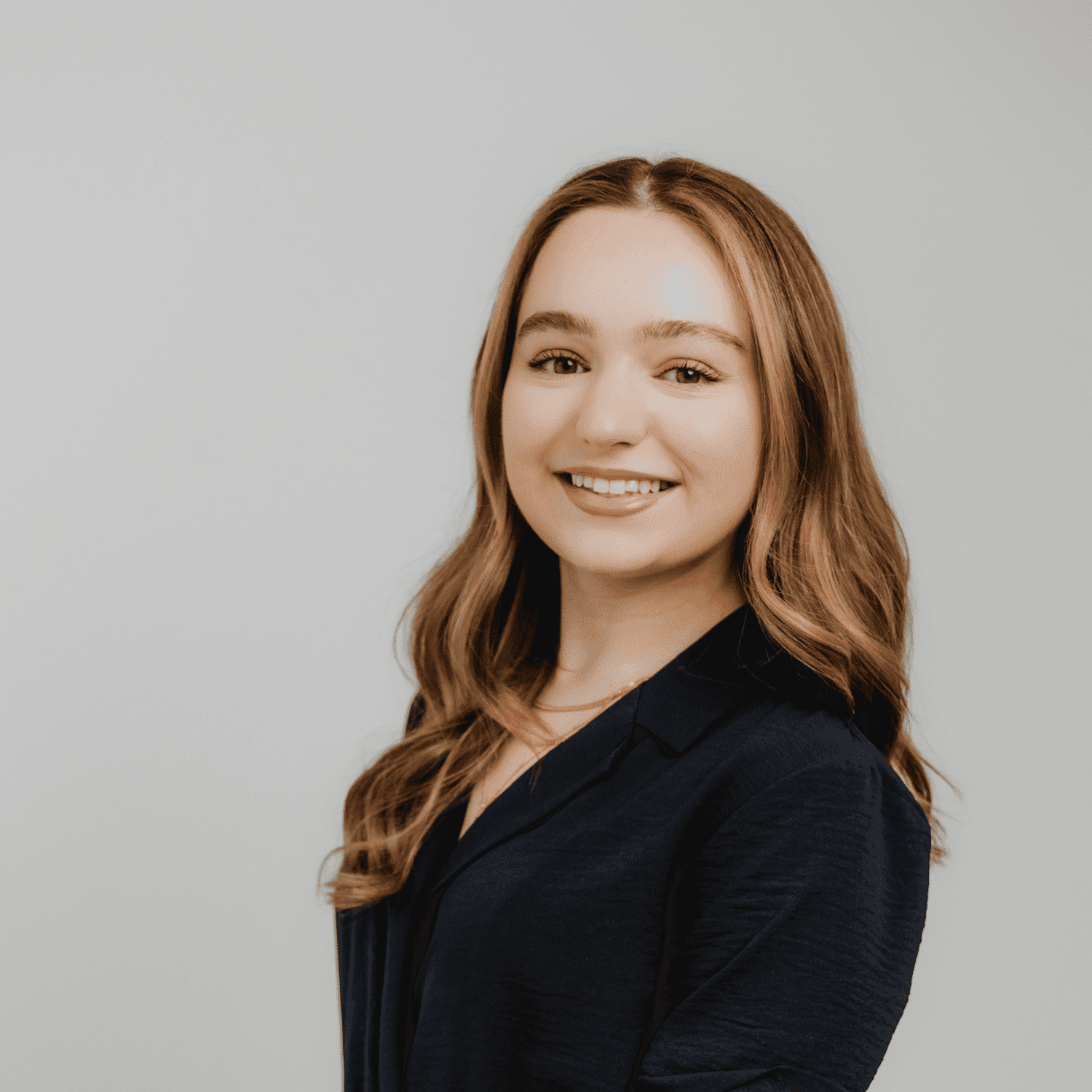 Portrait of Sam Toscano, a professional stylist at The Hair Bar, showcasing their expertise and style.