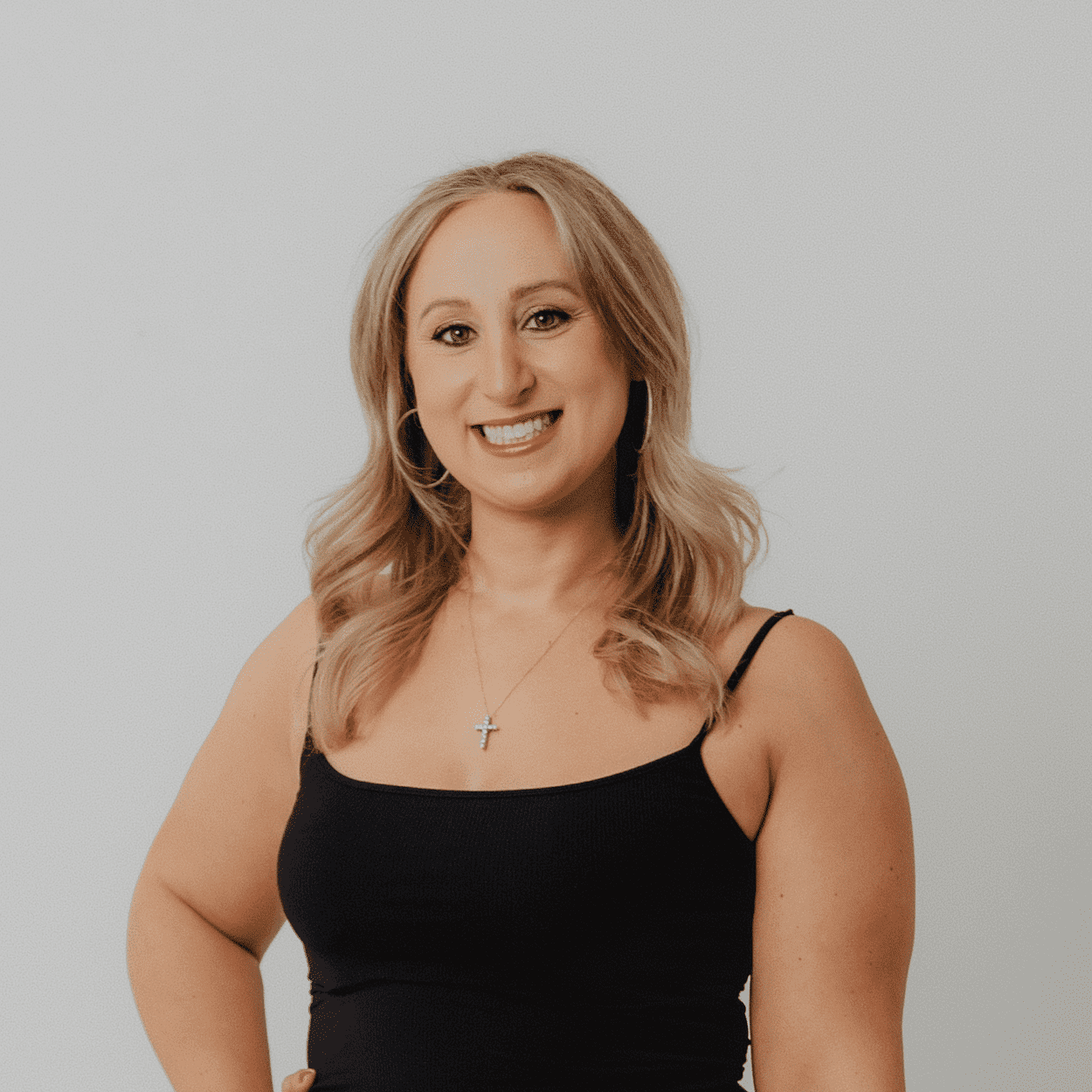 Portrait of Marissa Fernandez, a professional stylist at The Hair Bar, showcasing their expertise and style.