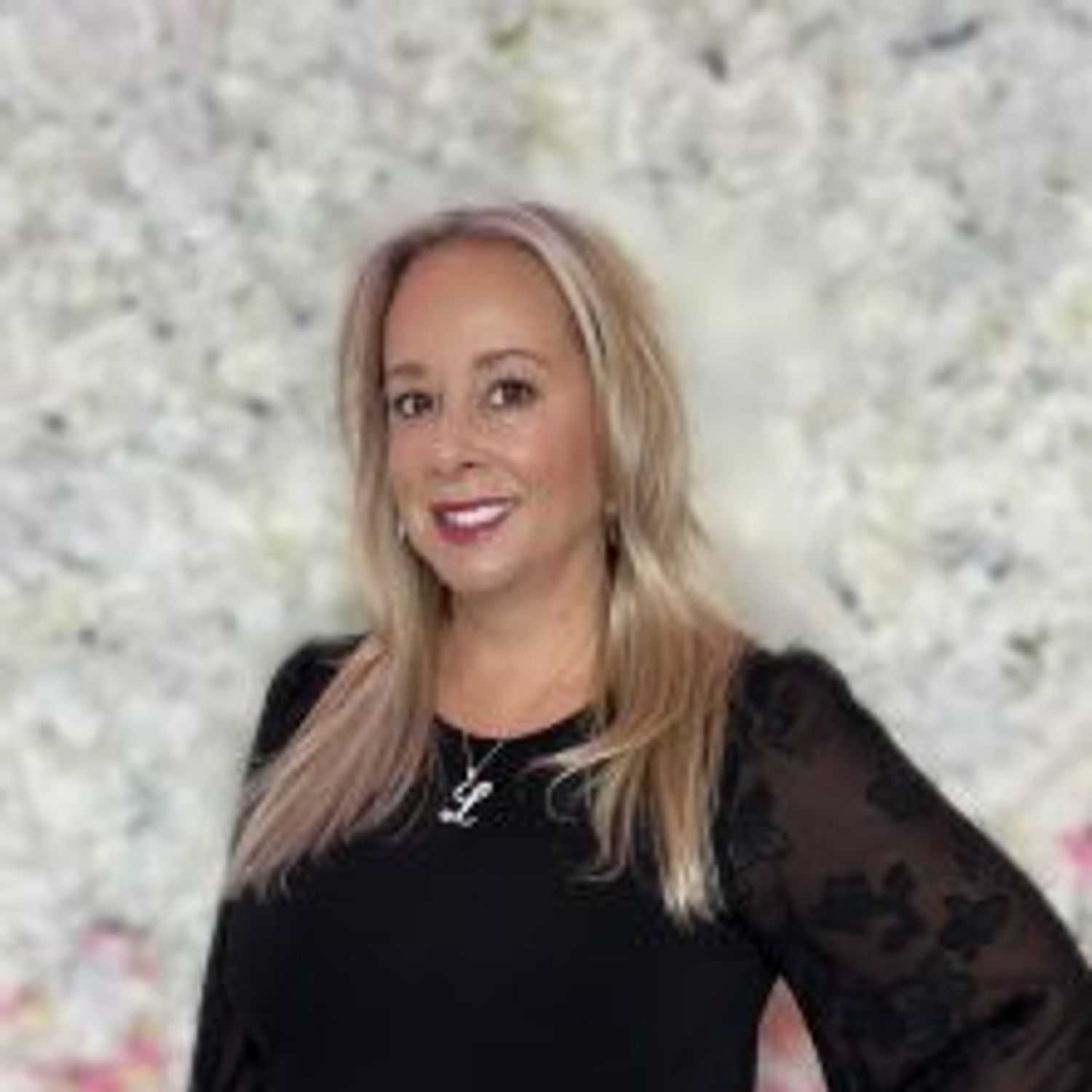 Portrait of Lisa DeFelice, a professional stylist at The Hair Bar, showcasing their expertise and style.