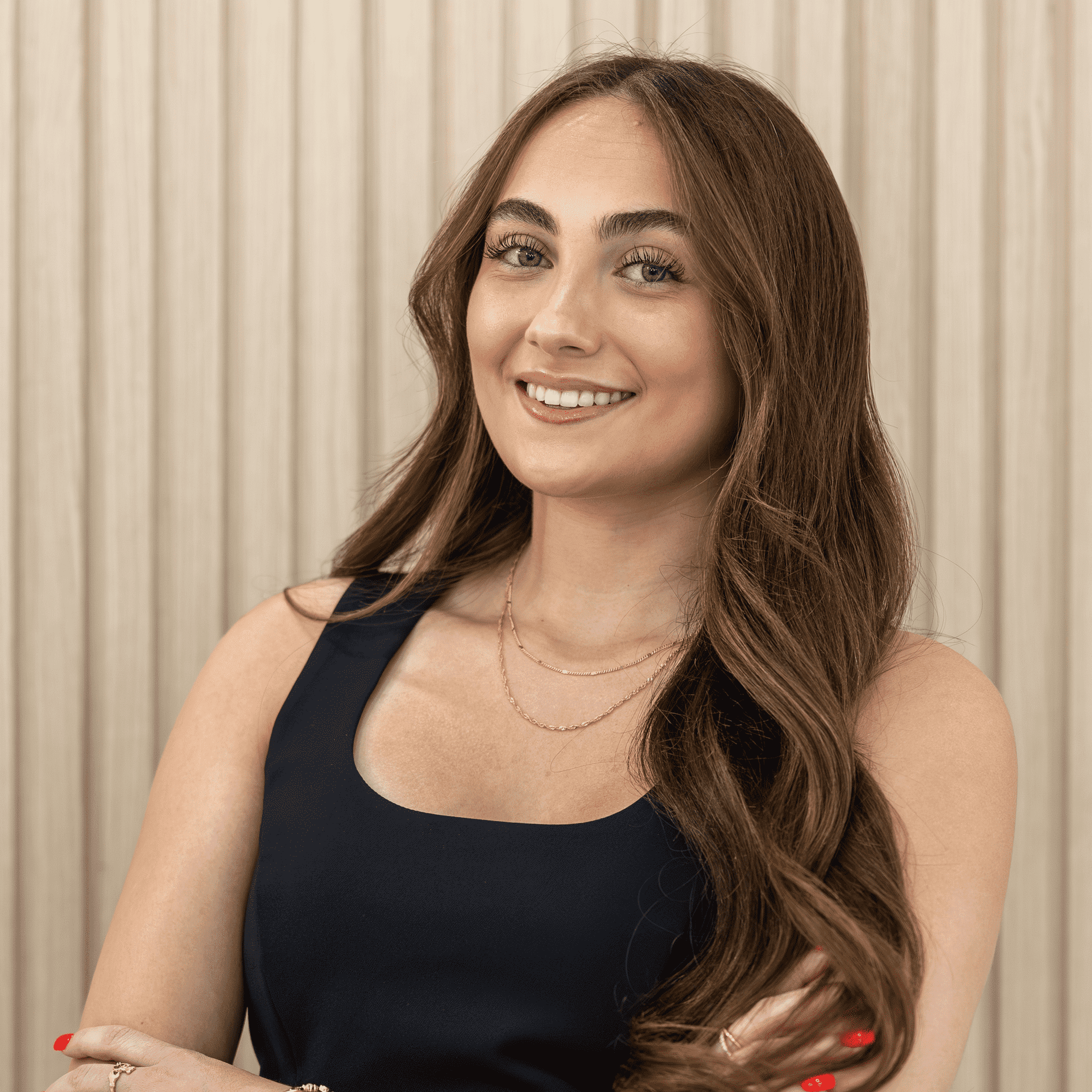 Portrait of McKayla Ryan, a professional stylist at The Hair Bar, showcasing their expertise and style.