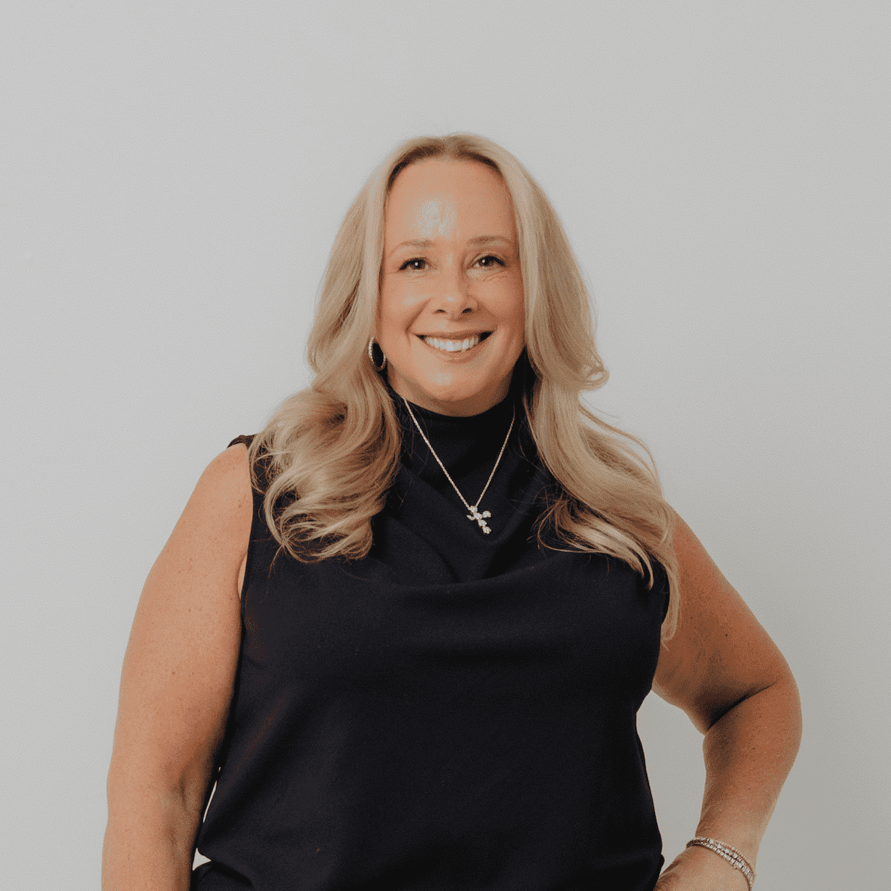 Portrait of Lisa DeFelice, a professional stylist at The Hair Bar, showcasing their expertise and style.